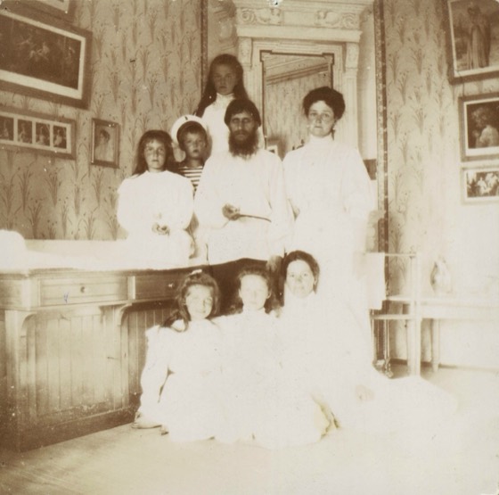 Rasputin with Romanov family photograph