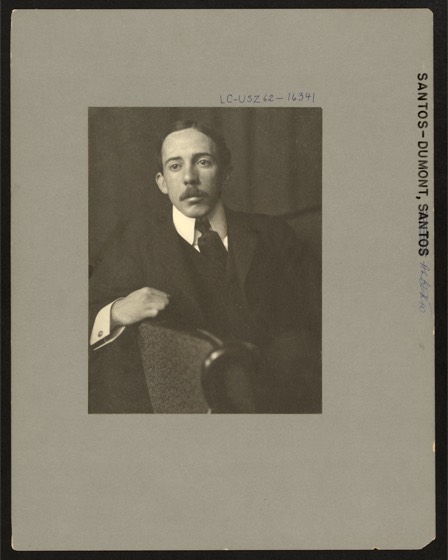 Alberto Santos-Dumont, half-length portrait, facing front, sitting, with right arm resting on back of chair.