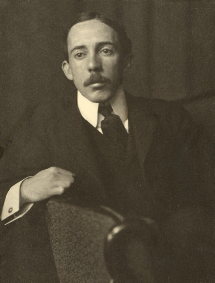 Alberto Santos-Dumont, half-length portrait, facing front, sitting, with right arm resting on back of chair.