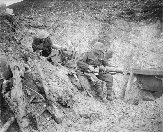 The Battle of the Somme, July-november 1916 Battle of the Ancre. Two soldiers of the 8th (Service) Battalion, North Staffordshire Regiment examine captured machine guns outside a badly damaged German dugout at Beaucourt-sur-Ancre.