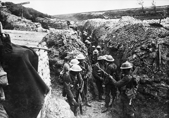 IWM caption : Battle of Albert : Soldiers of the 1st Battalion, The Lancashire Fusiliers fixing bayonets prior to the attack on Beaumont Hamel. They are wearing ‘fighting order’, with the haversack in place of the pack, and with the rolled groundsheet strapped to the belt below the mess-tin which co